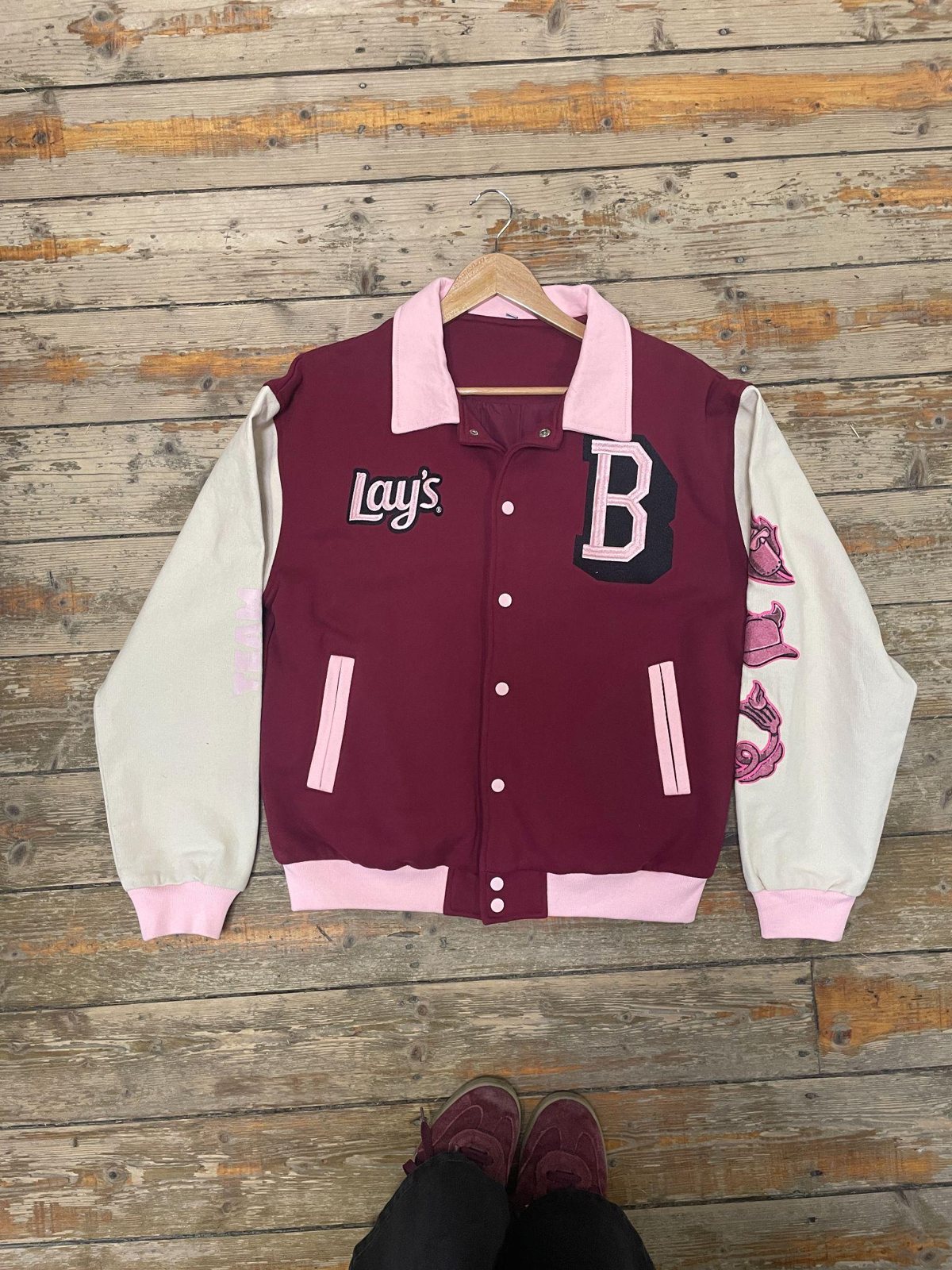 Maroon and cream varsity jacket
